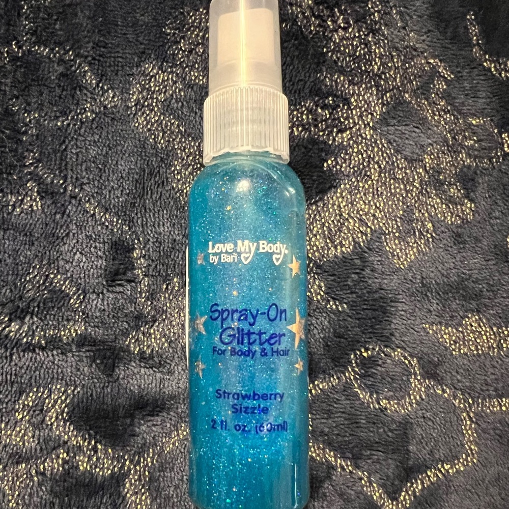 Blue and gold spray on body glitter